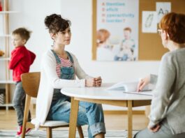 ADHD child's therapist talk with mother and ask questions during first session