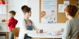 ADHD child's therapist talk with mother and ask questions during first session