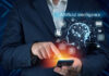 Businessman hand holding cellphone, smartphone with ai infographic.