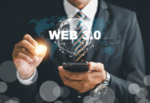 Embracing the Web 3.0 revolution, a businessman contemplates mobile phone strategies to capitalize on the futuristic trends of metaverse, blockchain, and fintech.
