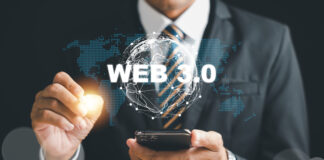 Embracing the Web 3.0 revolution, a businessman contemplates mobile phone strategies to capitalize on the futuristic trends of metaverse, blockchain, and fintech.