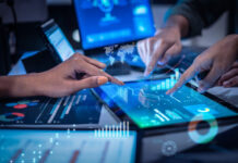 Close up hand team of financial discussion fintech technology planning, analyzing digital financial data and strategy in a modern office at night