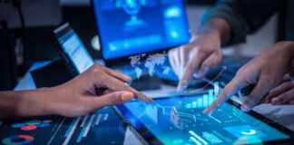 Close up hand team of financial discussion fintech technology planning, analyzing digital financial data and strategy in a modern office at night
