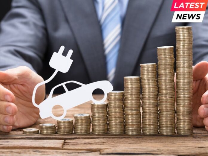 Businessman Protecting Coins With Electric Car At Table
