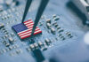 Flag of USA on a processor, CPU Central processing Unit or GPU microchip on a motherboard.