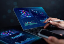 Analyst working with computer in Business Analytics and Data Management System