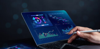 Analyst working with computer in Business Analytics and Data Management System