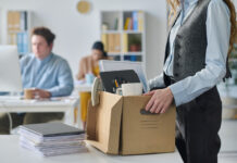 Why Most Companies Fail at RTO Close-up of young businesswoman packing her things at her workplace
