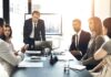Discussion, teamwork and financial advisors with company stocks, trading or profit growth in workplace.