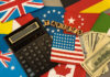 wooden cube block for tariffs on flags of different countries.
