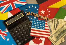 wooden cube block for tariffs on flags of different countries.
