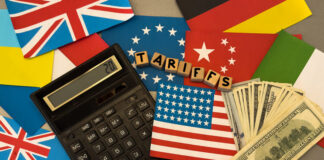 wooden cube block for tariffs on flags of different countries.