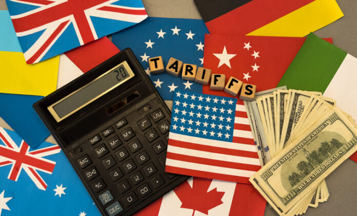 wooden cube block for tariffs on flags of different countries.
