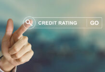 Business hand clicking credit rating button on search toolbar