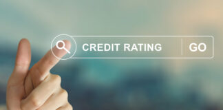 Business hand clicking credit rating button on search toolbar