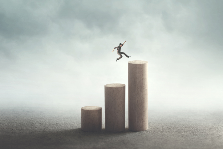 man big jump to reach the top