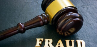 Word fraud and gavel as symbol of justice.