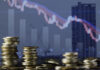 Coins stack and stock market investment graph,concept of business investment, stock future trading , clash and bear market with real estate background.