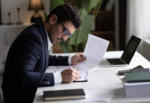 Businessman holding documents for finance