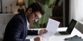 Businessman holding documents for finance