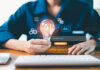 AI agent generate. user holding virtual AI lightbulb icon with Generate button, command prompt bar, symbolizing generative AI, idea creation, smart automation prompt based content generation systems
