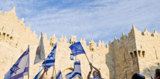 People of Israel waving their flag