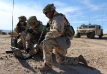 (Left to right) Spc. Ashley Lethrud-Adams, PFC Kleeman Avery, and Sgt. Alexander Lecea, cyberspace operations specialists with the Expeditionary Cyber Support Detachment, 782nd Military Intelligence Battalion (Cyber), provide support to the 1st Cavalry Division at the National Training Center.