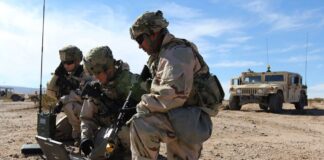 (Left to right) Spc. Ashley Lethrud-Adams, PFC Kleeman Avery, and Sgt. Alexander Lecea, cyberspace operations specialists with the Expeditionary Cyber Support Detachment, 782nd Military Intelligence Battalion (Cyber), provide support to the 1st Cavalry Division at the National Training Center.