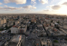 The destruction of Omar Al-Mukhtar Street in central Gaza and the rubble of Al-Shorouk Tower