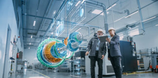 Factory Digitalization: Two Industrial Engineers Use Tablet Computer, Analysing Data about a 3D Model of Green Energy Engine. Industry 4 High-Tech Electronics Facility with Manufacturing Products