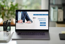 Financial services for business people, laptop with website on screen on office desk