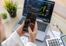 AnteraCapital365.net Complies With KYC And AML Policy For Security Purpose Woman with stock market chart financial trading, online investment, stock exchange analysis, market trends, real-time trading data, forex and crypto trading economic forecasting tool