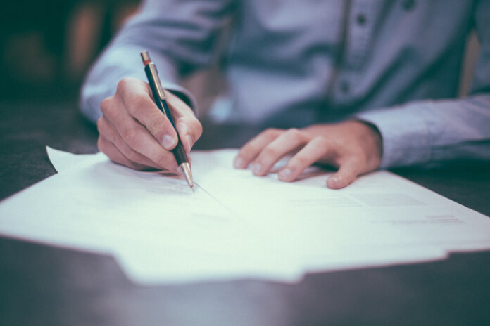 lawyer legal paper pen sign signature signing writer writing