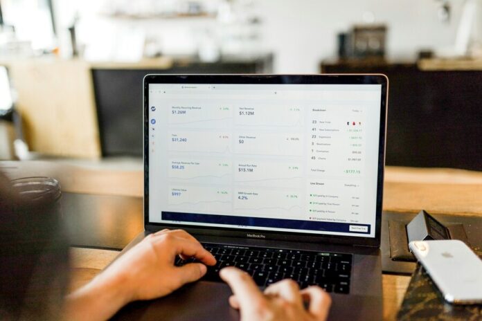 austin-distel-744oGeqpxPQ-unsplash (1) (1) Person bookkeeping using macbook pro