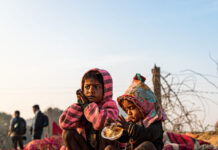 Manufactured Famines in Gaza Began Almost Two Decades Ago, So Why Haven’t They Been Halted? portrait of a poor kid eating food in gaza. Famine in gaza concept