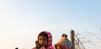 portrait of a poor kid eating food in gaza. Famine in gaza concept