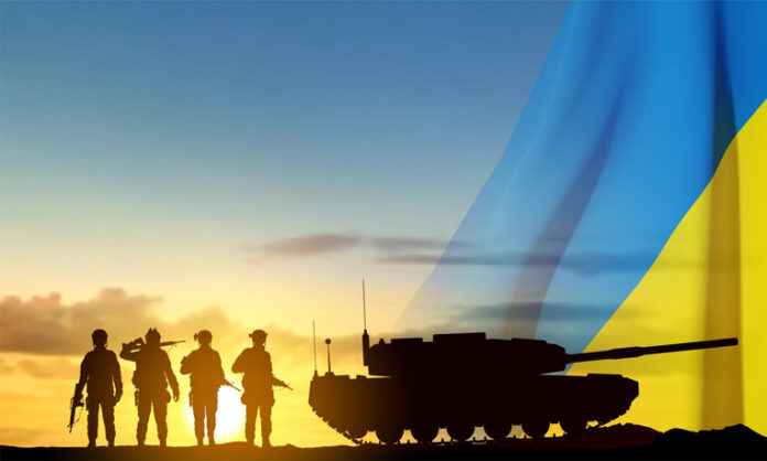 Silhouettes of a soldiers and a main battle tank Silhouettes of a soldiers and a main battle tank on a battlefield with Ukraine flag against the sunset.