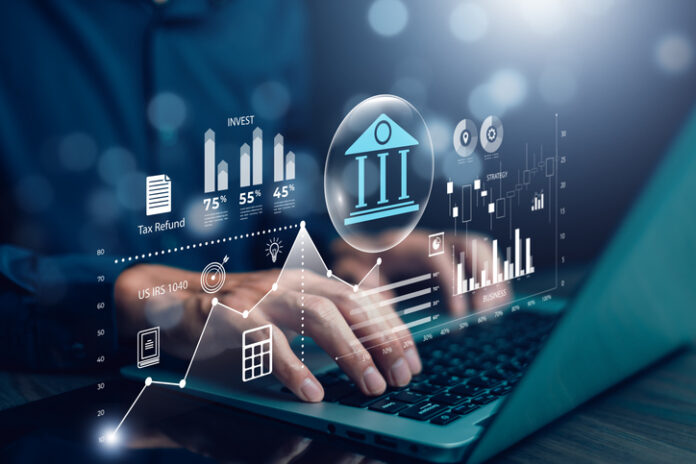 Businessman using the laptop with bank and tax icons,Concept of tax payment optimisation business finance financial firm digital platform