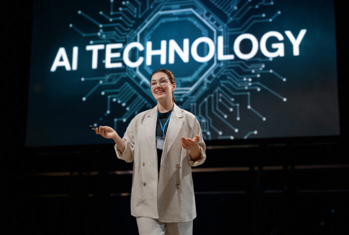 A woman having workshops on stage about the future of AI technologies.