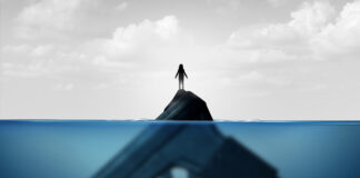 Gun concept as a child standing on a giant firearm submerged in water as a symbol for guns and violence and the risk of weapons