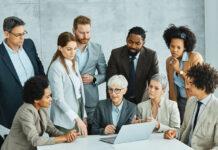 Practical Strategies to Improve Staff Retention Using Company Perks Boss together with the employees having a meeting