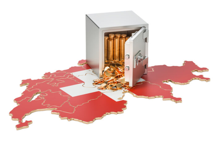 Safe box with golden coins on the map of Switzerland, 3D rendering Safe vault in the map of