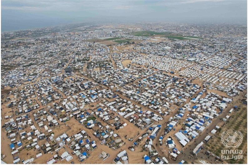 Displaced Palestinians in the ruins of Gaza