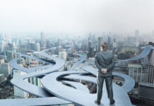 Designing FP&A for Decision Advantage: A Framework for Processes, Systems, and Skills at Enterprise Scale Businessman stands choosing his way on city