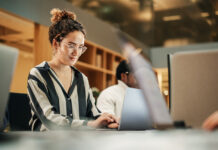 New Data Shows Flexible Companies Grow 1.7x Faster Diverse Group of Creative Colleagues Working on Laptops in Modern Office.