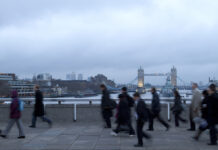 Early morning rush hour, financial sector workers going to work in the City of London. UK Policy & Offshoring for overseas workers