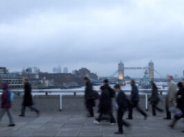 Early morning rush hour, financial sector workers going to work in the City of London. UK Policy & Offshoring for overseas workers