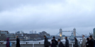 Early morning rush hour, financial sector workers going to work in the City of London. UK Policy & Offshoring for overseas workers