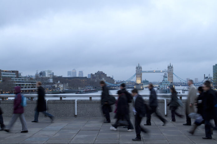 Early morning rush hour, financial sector workers going to work in the City of London. UK Policy & Offshoring for overseas workers