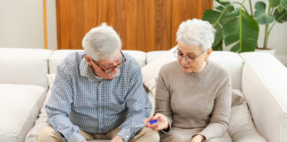 senior citizen checking on their savings accounts